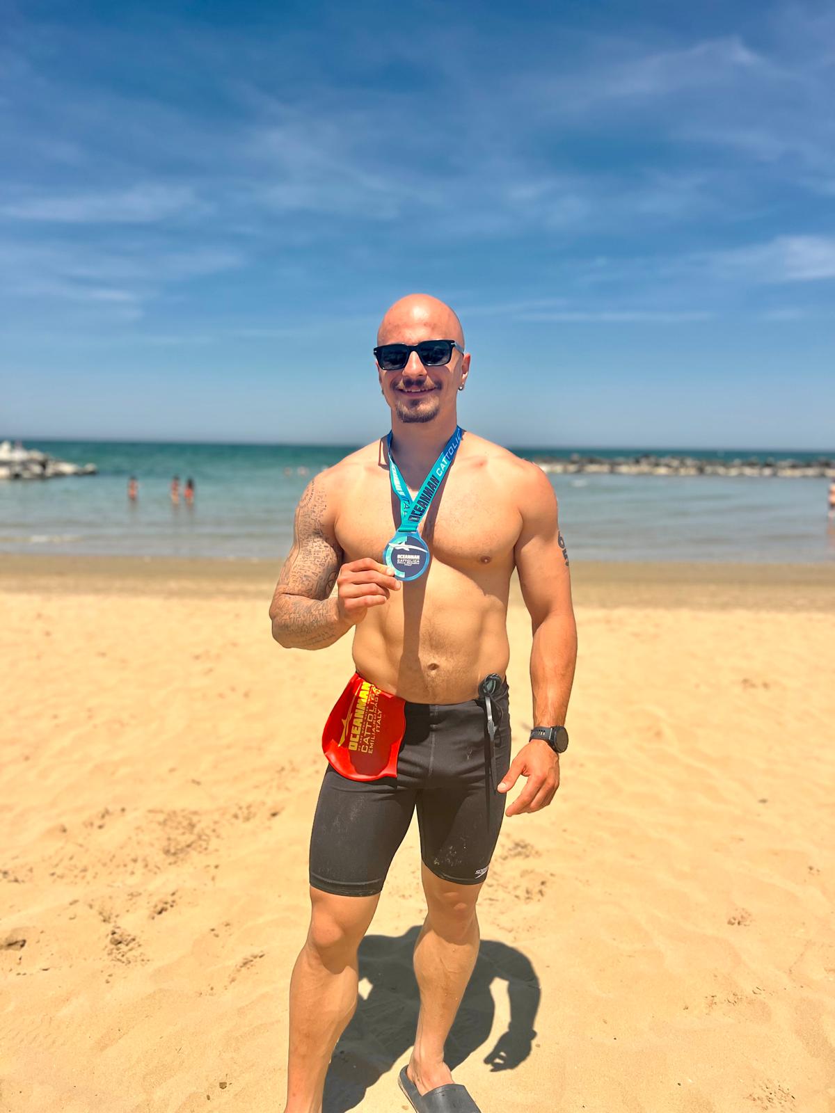 Celebrating after the OCEANMAN Cattolica 5K Open Water Race 2026.